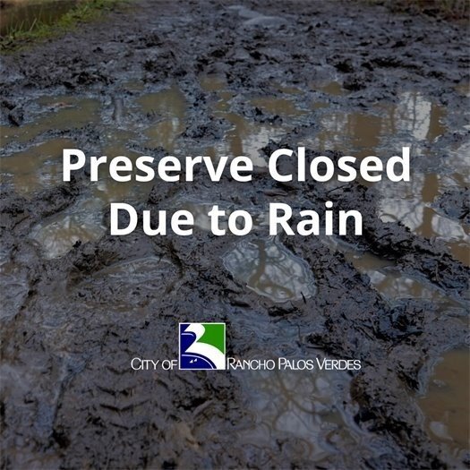 Preserve Closed due to Rain text overlap over muddy trails.
