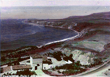 View of the Harden Estate Gatehouse in the 1930s with the landscape, shoreline, and water